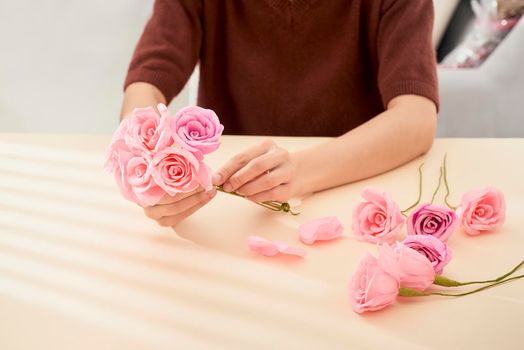 People making paper craft flower art 