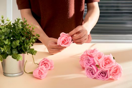 People making paper craft flower art 