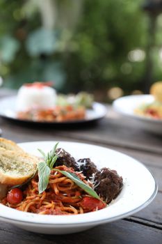 Spaghetti Meatballs on wood background