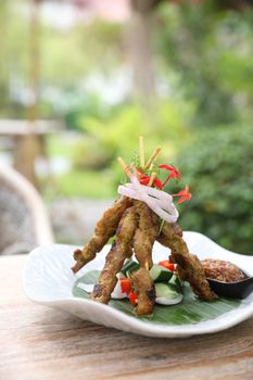 Chicken Satay on dark brown table street food appetizer