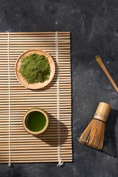 Organic Green Matcha Tea on wooden table, copyspace