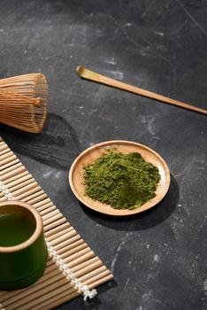 Organic Green Matcha Tea on wooden table, copyspace