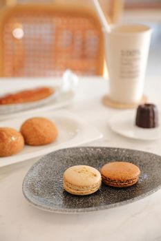 brown macaron dessert in coffee shop background