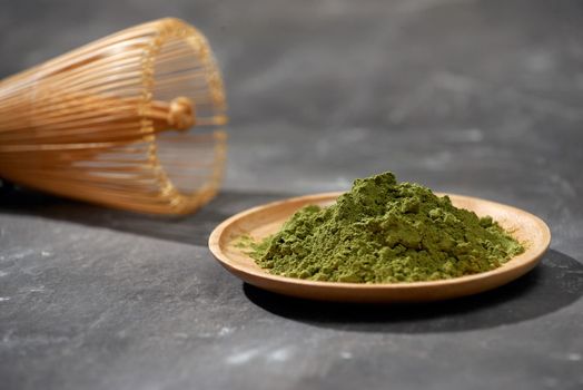 Organic Green Matcha Tea on wooden table, copyspace