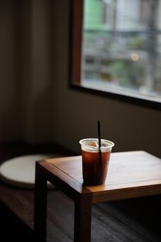 ice coffe on wood table in local coffee shop