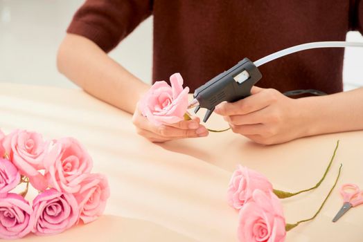 People making paper craft flower art 