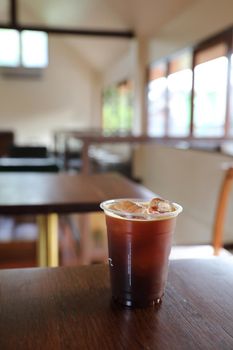 ice coffe on wood table in local coffee shop