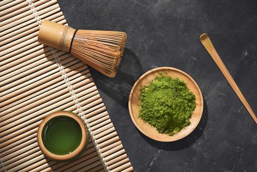 Organic Green Matcha Tea on wooden table, copyspace