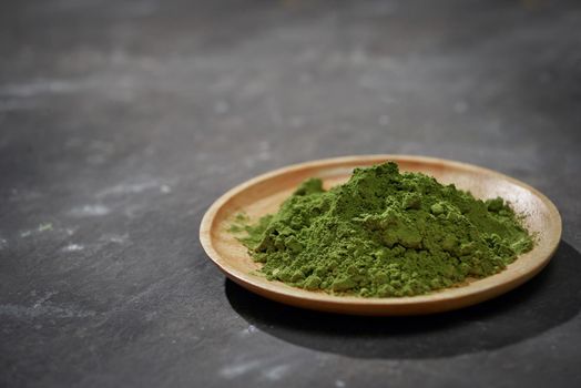 Organic Green Matcha Tea on wooden table, copyspace