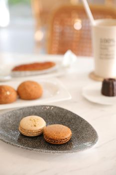 brown macaron dessert in coffee shop background