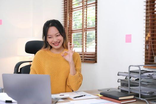 Online video conference and Digital meeting. Business woman discussing business with team by video conference in home office..