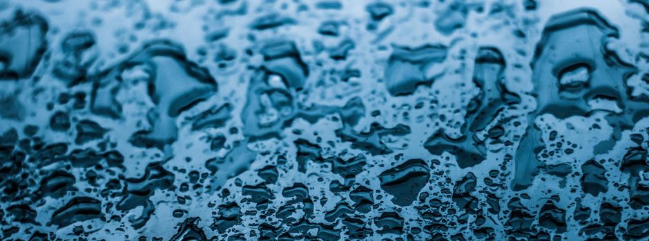 Liquid, wet and zen concept - Water texture abstract background, aqua drops on blue glass as science macro element, rainy weather and nature surface art backdrop for environmental brand design