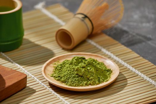 Organic Green Matcha Tea on wooden table, copyspace