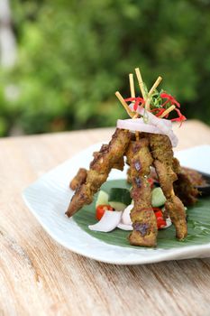 Chicken Satay on dark brown table street food appetizer