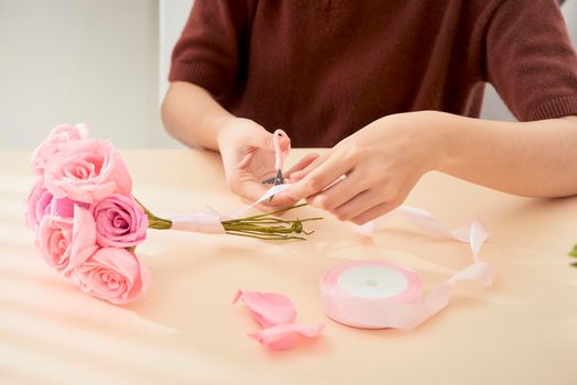 People making paper craft flower art 