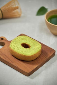 Close up on green matcha Baumkuchen Japanese roll cakes, selective focus