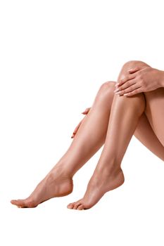 Long pretty woman legs, isolated on white. Healthy lifestyle, sport, healthcare, nutrition and diet concept.