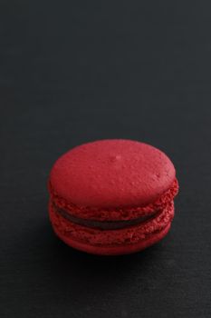 Colorful macarons isolated in black background