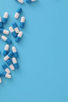 pills capsules isolated on blue background