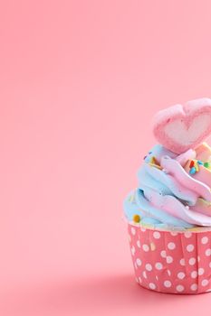 colorful cupcake isolated in pink background