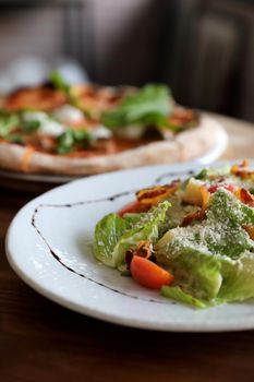 caesar salad appetizer on wooden background