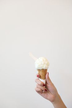 Woman hand with ice cream in close up