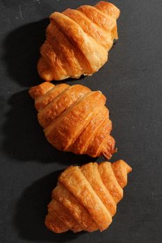 Croissant isolated in  wihite background with sunny light 