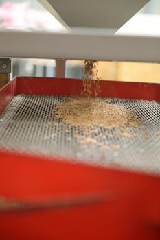 Factory machine Milling rice in close up