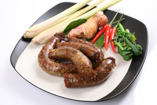 Local Northern Thai food , Northern Thai spicy sausage street food isolated in white background