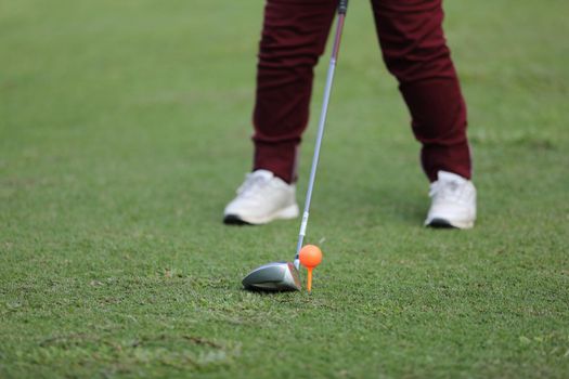 Young male golfer player on golf course