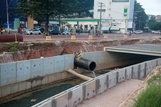 salvador, bahia, brazil - july 29, 2022: construction of sewage pipeline exclusive way for BRT transport system in the Lucaia canal region in the city of Salvador.