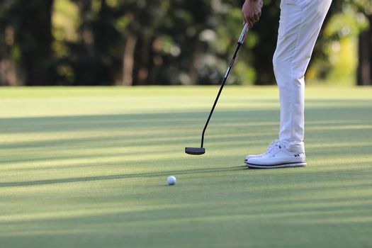 Young male golfer player on golf course