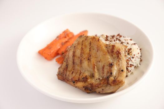 Grilled chicken with rice isolated in white background