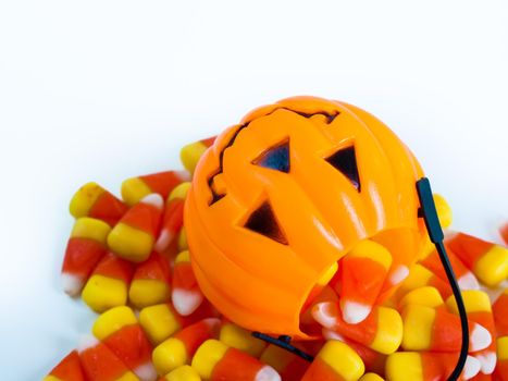 Candy corn candies falling out of Halloween treat bag.