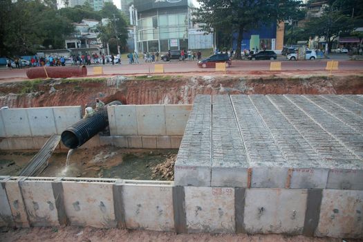 salvador, bahia, brazil - july 29, 2022: construction of sewage pipeline exclusive way for BRT transport system in the Lucaia canal region in the city of Salvador.