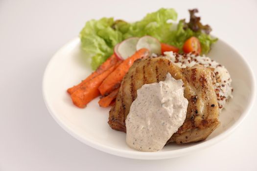 Grilled chicken with rice isolated in white background