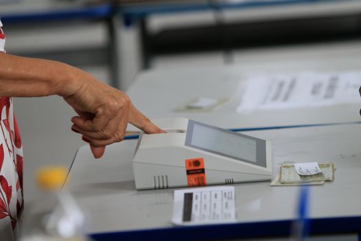 salvador, bahia, brazil - october 2, 2022: poll workers working in the voting section of a public school during general elections in the city of Salvador