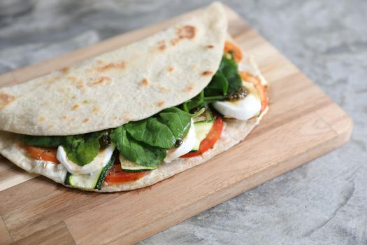 Italian cuisine , Piadina with tomatoes and cheese