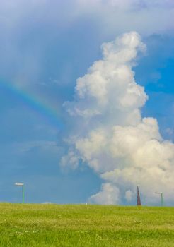 Beautiful rainbow and clouds on the horizon in Center of Bremerhaven Bremen Germany.