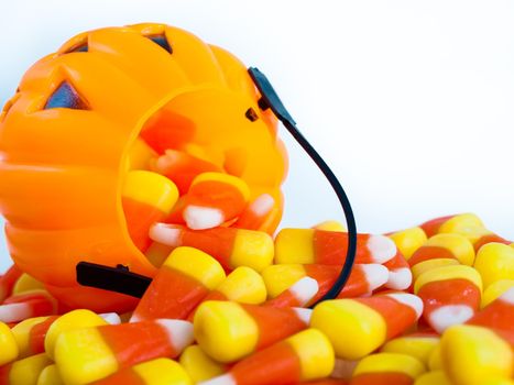 Candy corn candies falling out of Halloween treat bag.
