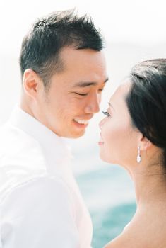 Smiling man and woman tilted their faces towards each other. Portrait. High quality photo