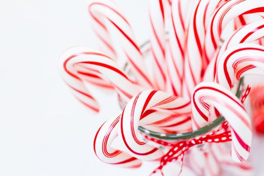 Peppermint candy canes on white background.
