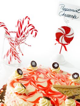 Traditional Christmas White Chocolate Peppermint Cheesecake on white background.