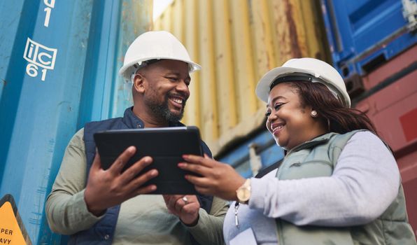 Logistics, supply chain and tablet with a man and woman shipping worker working on a dock for export. Internet, technology and cargo with a team at work in a container yard for distribution industry.