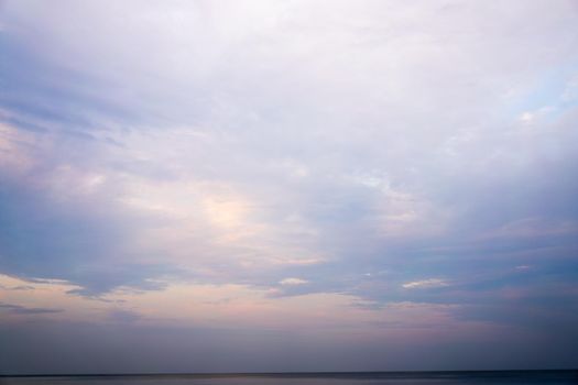 Beautiful dramtic cloudy sky sunset background under sea water With yellow orange colors