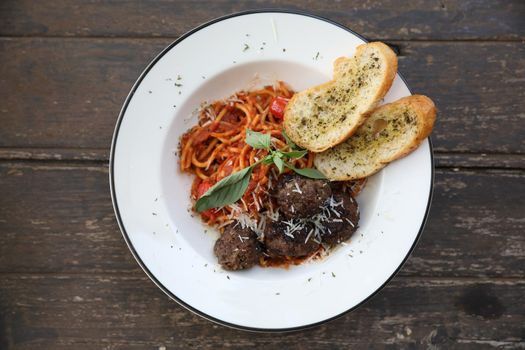 Spaghetti Meatballs on wood background