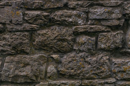 Old castle stone wall texture background texture. High-quality photo