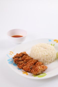 Thai food gourmet fried chicken with rice , khao mun kai in wood background 