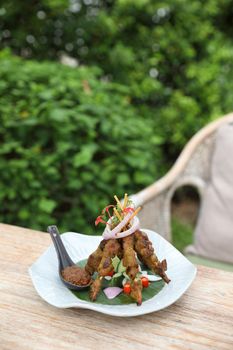 Chicken Satay on dark brown table street food appetizer