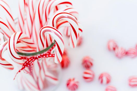 Peppermint candy canes on white background.